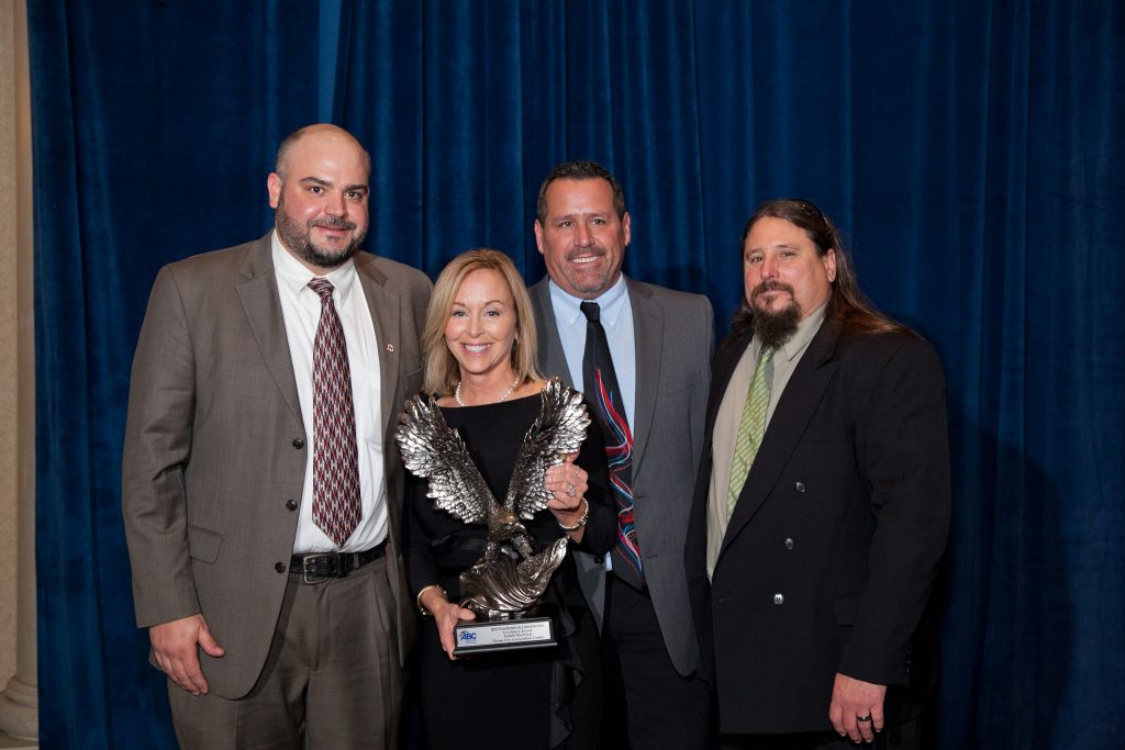 Pictured left-right: Estimator James Vanderslice, ABC Chairwoman and GG+A Vice President Lorri Grayson, President/CEO Steve Dignan, Foreman/Pre-Fab Manager John Zuvich accepting the ABC Delaware Excellence in Construction award for the Ocean City Convention Center project. Eric Crossan Photography. (This project also won an EIC award from the ABC Chesapeake Shores Chapter)